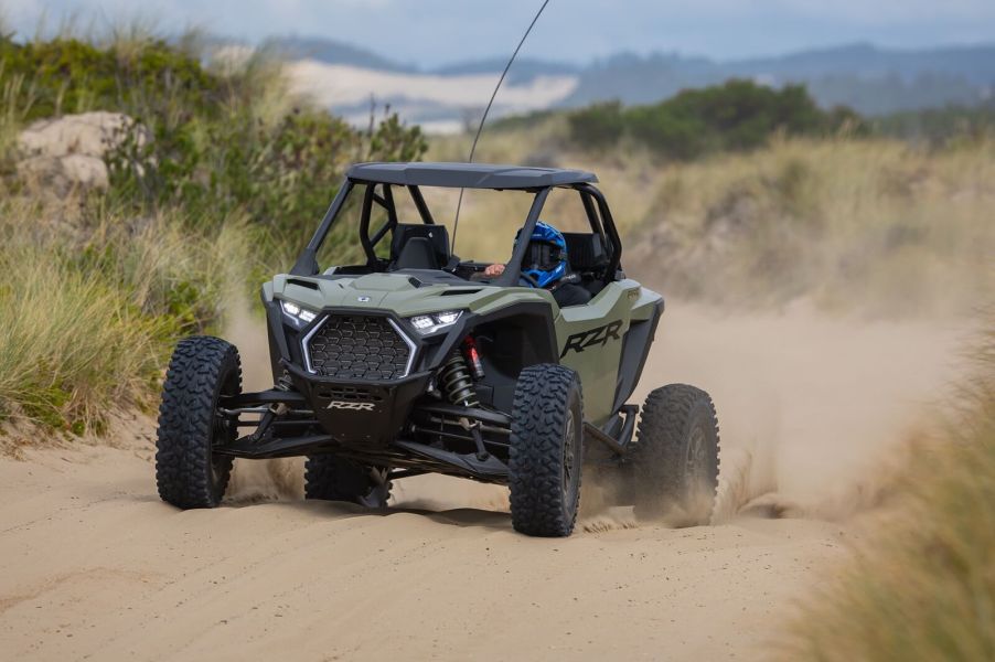 MotorBiscuit Staff Writer Erik Sherman kicks up dust and sand in Coos Bay, Oregon in a Polaris SxS.