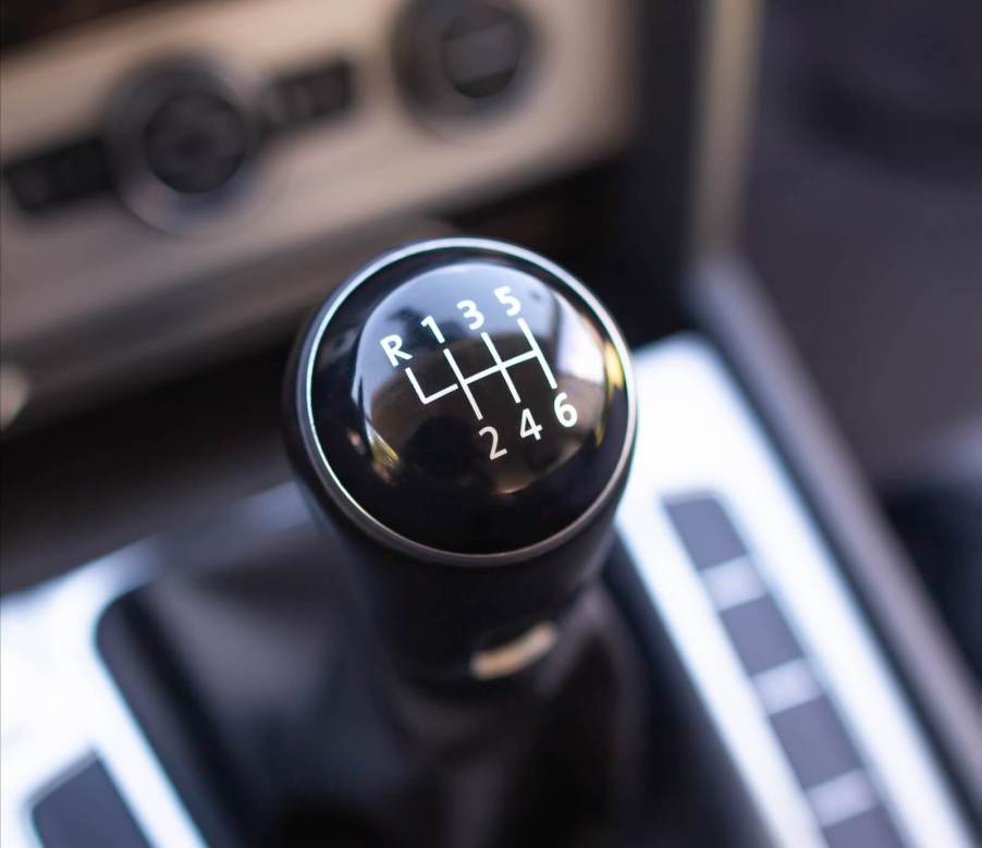 A manual gear shifter invites new drivers to learn how to drive a manual in 2024.