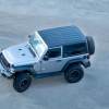 Overhead view of a silver Jeep Wrangler SUV.