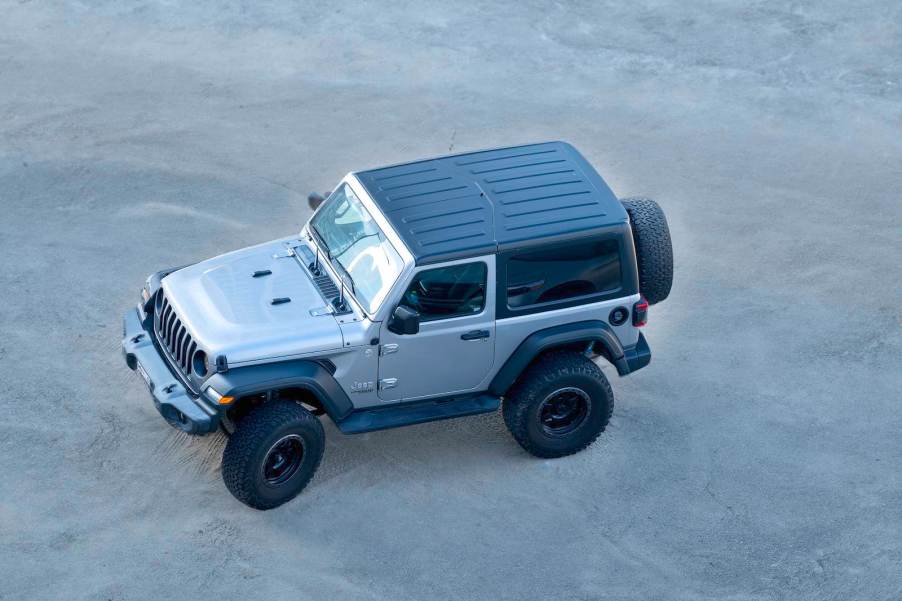 Overhead view of a silver Jeep Wrangler SUV.