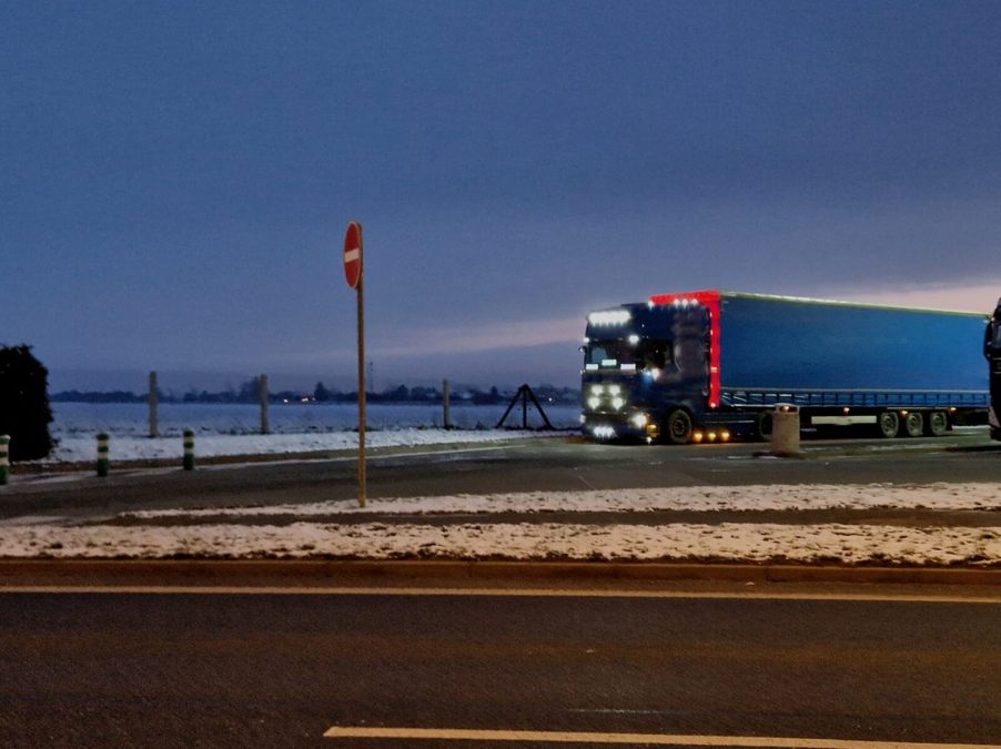 A truck uses its many LED light bars to illuminate the road ahead.