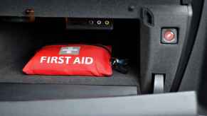 A car emergency medical kit in a vehicle glove box