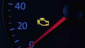 A yellow check engine light in close view a check engine light flashing means severe damage is possible