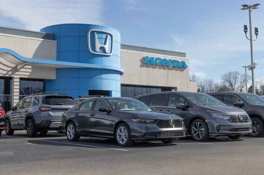 The exterior view of a Honda dealership with vehicles parked out front