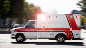 An ambulance speeding through an intersection