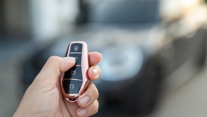 A person using a car key fob