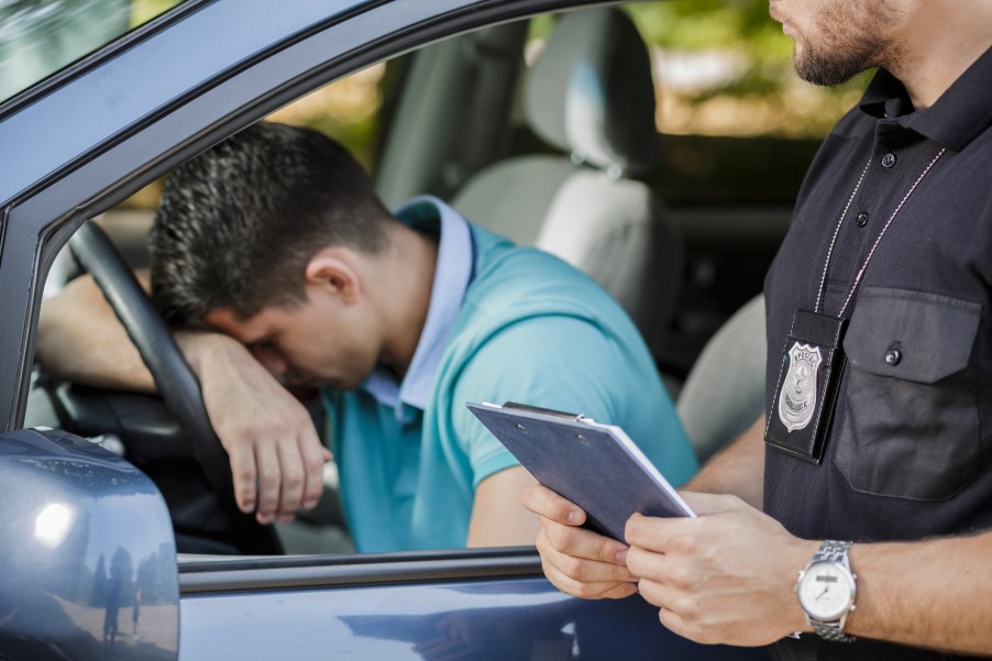 A man sad about getting a speeding ticket