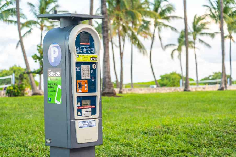 A ParkMobile parking meter in front of palm trees some ParkMobile meters are being targeted by a parking scam in 2024