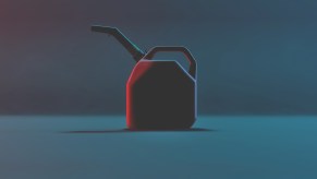 Red plastic gasoline can sitting in darkened space