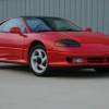 The 1992 Dodge Stealth parked by a wall