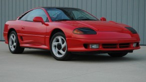 The 1992 Dodge Stealth parked by a wall