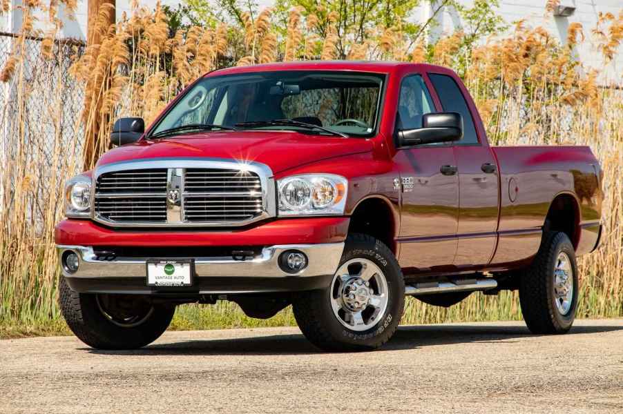 A red 2008 Dodge Ram pickup truck parked in left front angle view