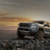 The 2024 Nissan Frontier climbing over rocks