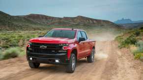 The 2025 Chevy Silverado 1500 driving down a dirt road