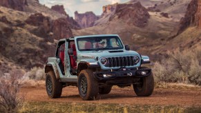 The 2025 Jeep Wrangler off-roading in dirt