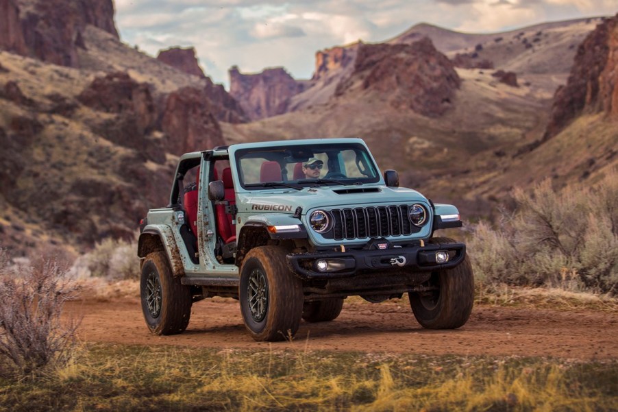 The 2025 Jeep Wrangler off-roading in dirt