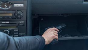 A driver reaches for a handgun replica in an episode of road rage.