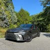 The 2024 Toyota Camry Hybrid in a park