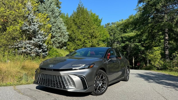 The 2024 Toyota Camry Hybrid in a park