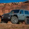 A gray Jeep Wrangler Rubicon on a hill.