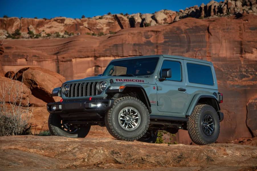 A gray Jeep Wrangler Rubicon on a hill.