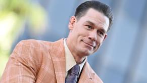 John Cena, one of the celebrities who drives the cars he promotes in ads, smiles at an event.