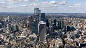 The skyline of the city of London on a sunny day, dominated by the walkie talkie building with its heat death ray.