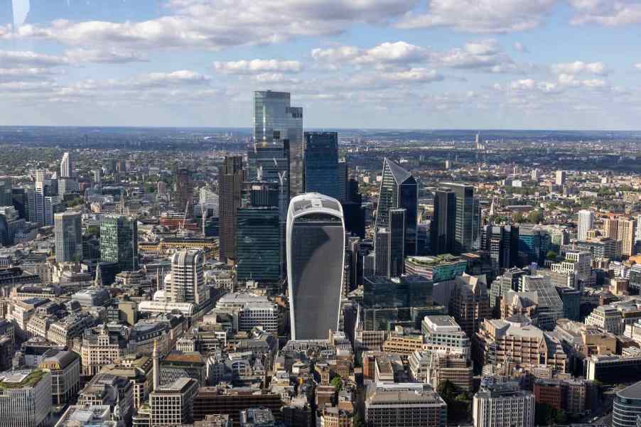 The skyline of the city of London on a sunny day, dominated by the walkie talkie building with its heat death ray.