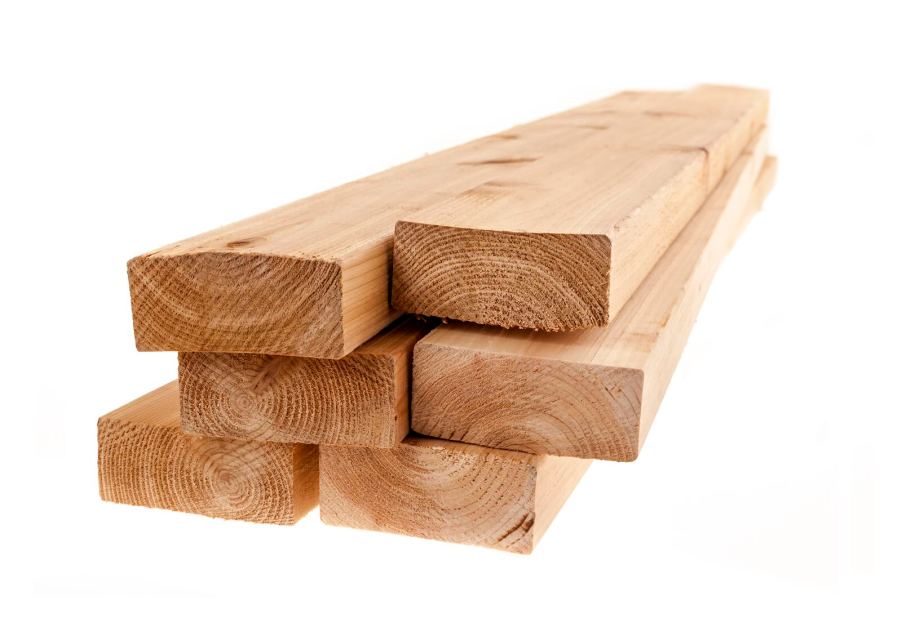 Wooden lumber boards stacked on a white background.