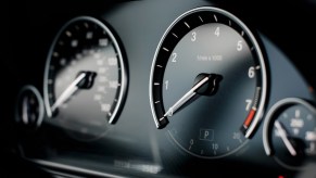 The odometer and speedometer on a sedan.