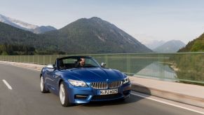 A BMW Z4, like the E89 model in the latest BMW recall, drives across a bridge.