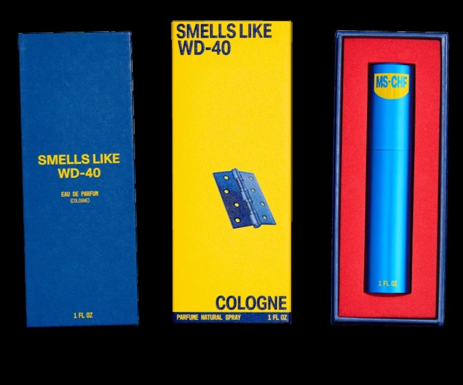 Product photo of the 'Smells Like WD-40' cologne spray bottle and its bright yellow box