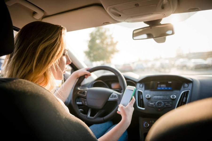 Teenage drivers like this one are likely to drive distracted.