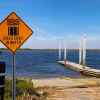 A boat ramp in Charleston, South Carolina, with a sign that reads "Road ends in water."