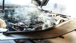 A car engine smoking in close view