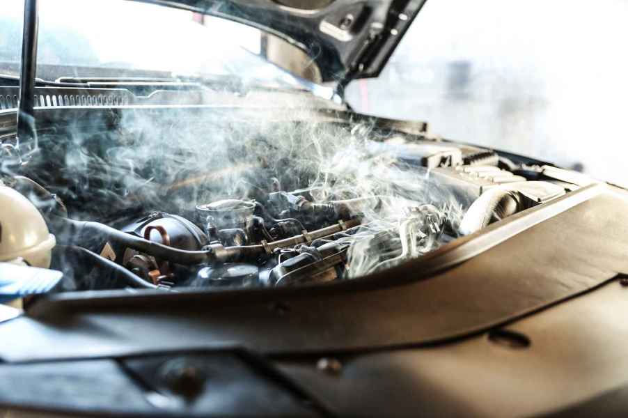 A car engine smoking in close view