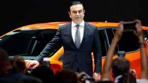 Ex-Nissan CEO Carlos Ghosn on stage at an auto show in 2016