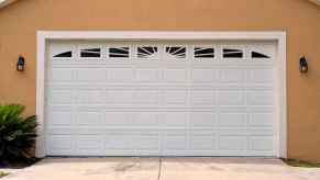 A white two-car garage door on residential home