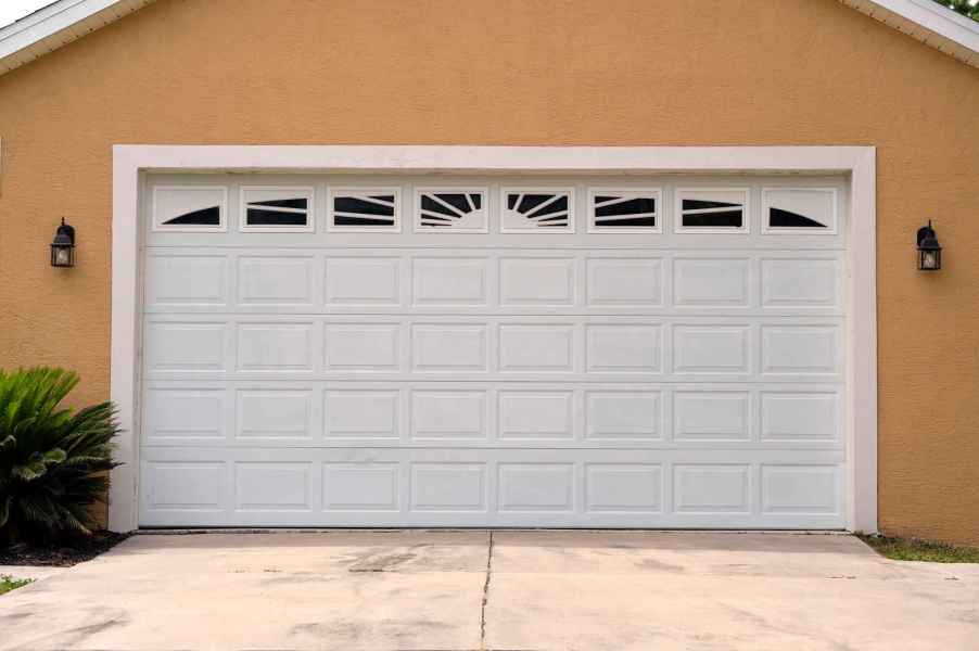 A white two-car garage door on residential home