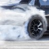 A smoking tire on a race track