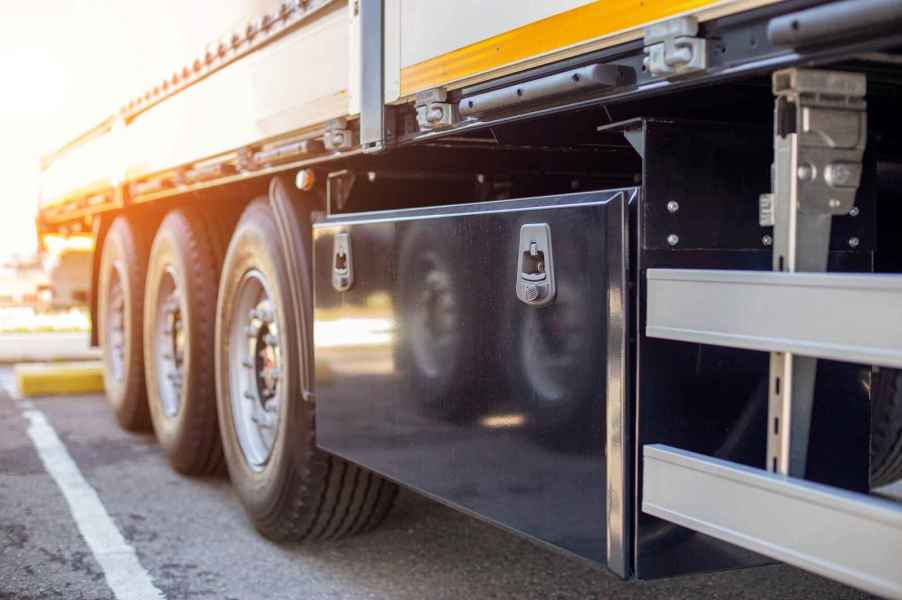 Semi-truck trailer toolbox mounted on left side in close view