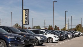 Used cars parked outside on a car dealer lot