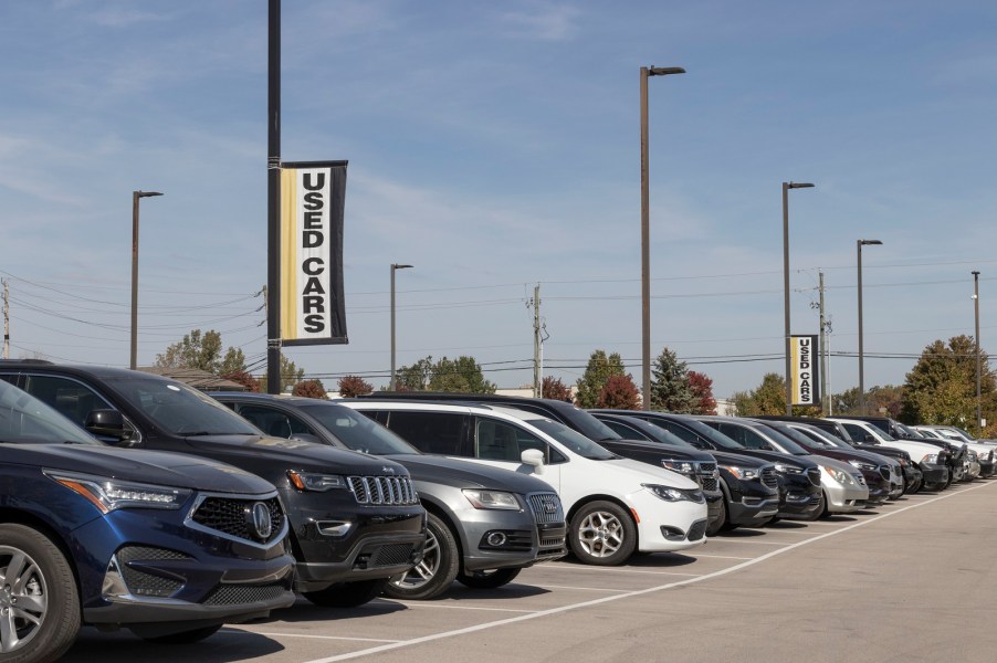 Used cars parked outside on a car dealer lot