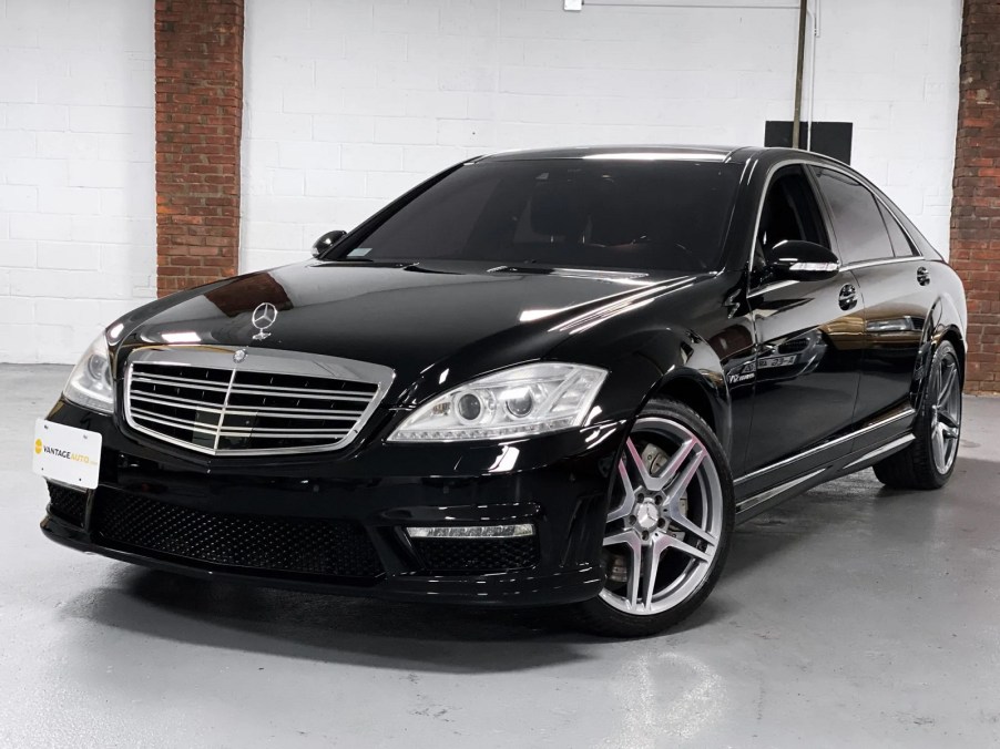 A black 2007 Mercedes-Benz S65 AMG parked in right front angle view in a showroom