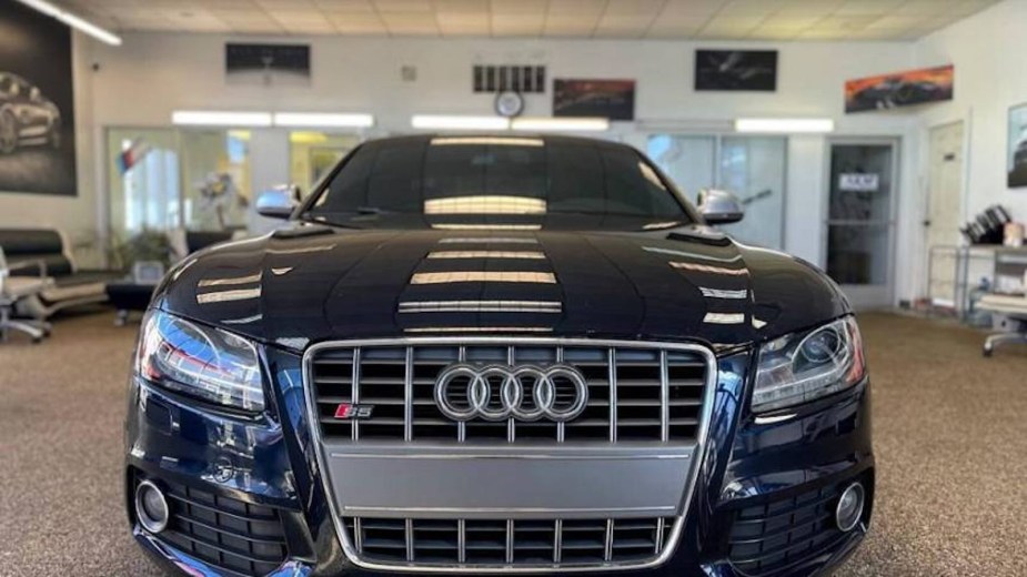 The grille of a black Audi S5 coupe.