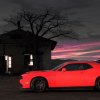 A bright red Dodge Challenger SRT Hellcat and its thirsty supercharger with a horsepower need beyond a Mitsubishi Mirage at night.