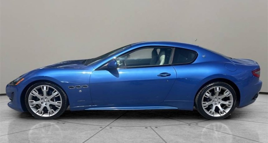 Profile view of a blue Maserati GranTurismo grand tourer