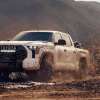 The 2024 Toyota Tundra Hybrid splashing through mud