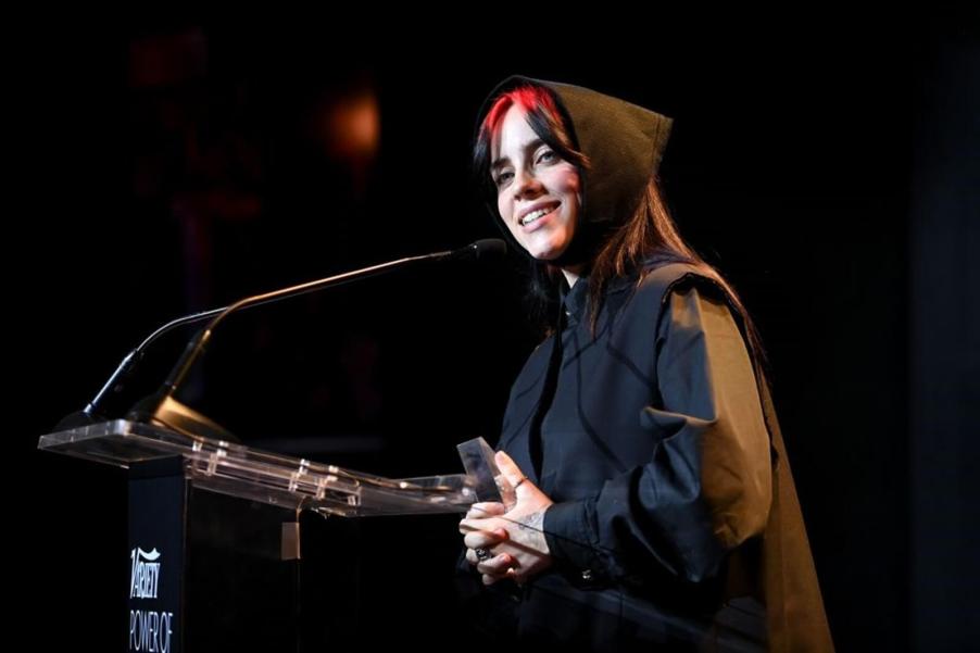 Billie Eilish smiles at an event celebrating successful women.