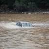 A driver will have to file a claim with their car insurance provider after their vehicle has flood damage.